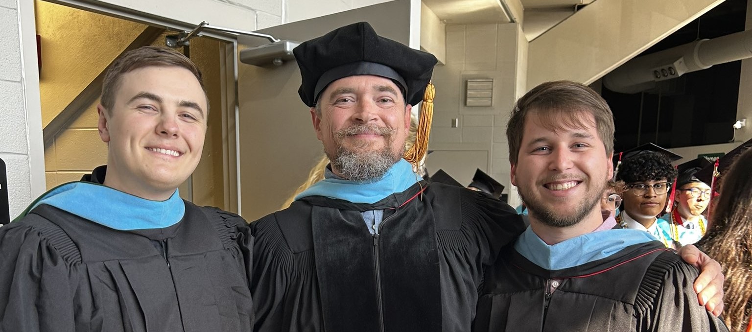 Spencer Stone with his esports championship team holding a trophy