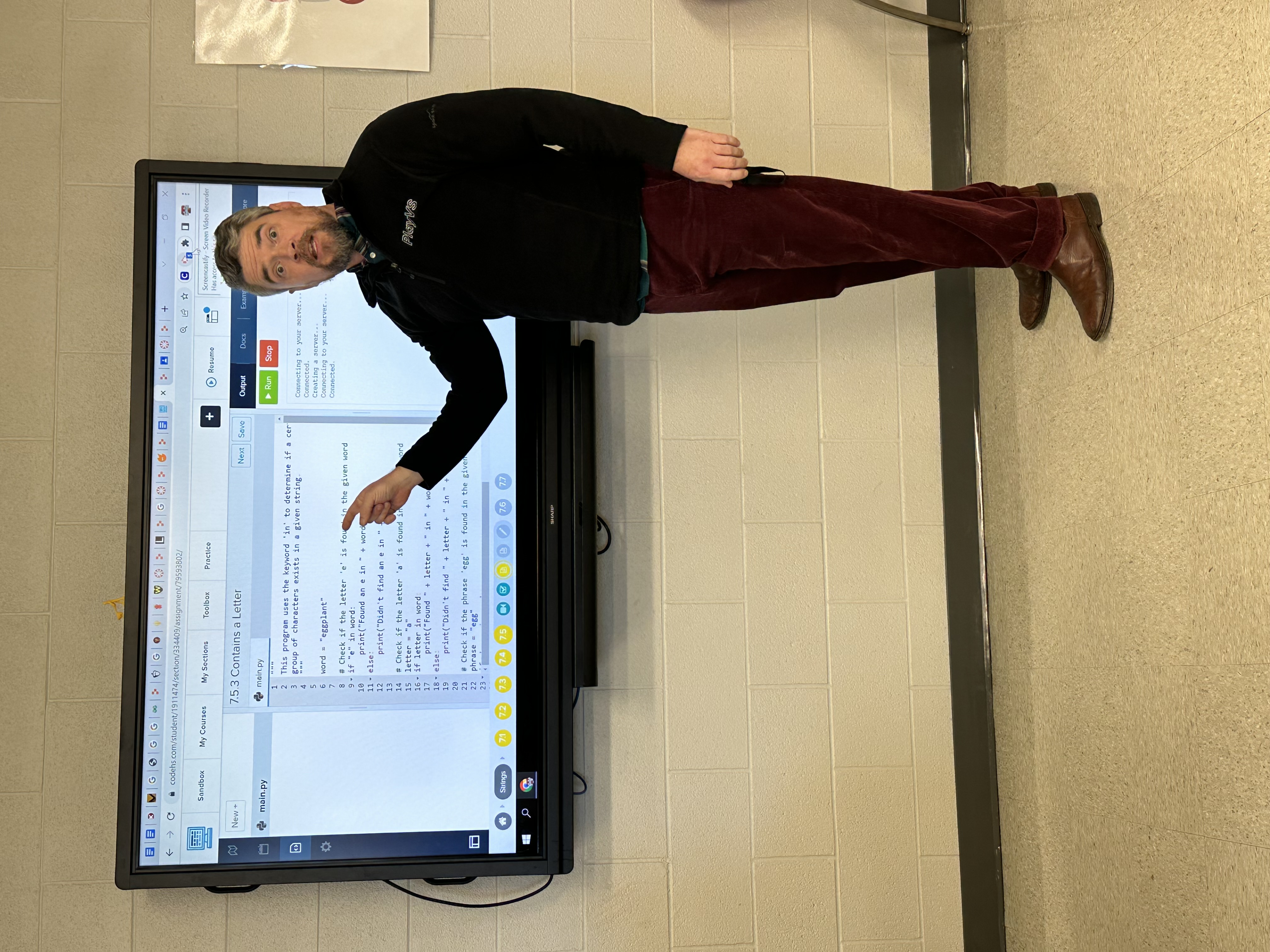 Spencer Stone teaching computer science at an interactive screen